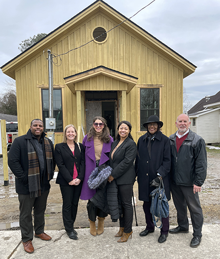 Staff Standing in front of the Schoolhouse
